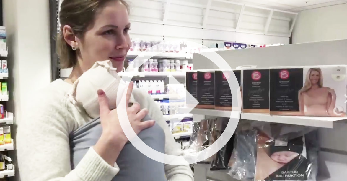 En kvinne i hvit labfrakk